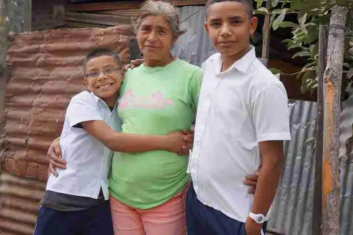 Oscar with his grandmother and brother