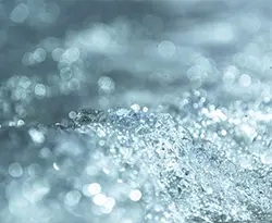 Clear water splashing and swirling. It has a slight blue colour