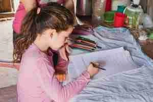 Carolina studying on a desk in Paraguay