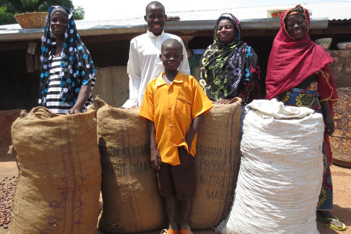 Haruna and his family with four sack of Shea nuts