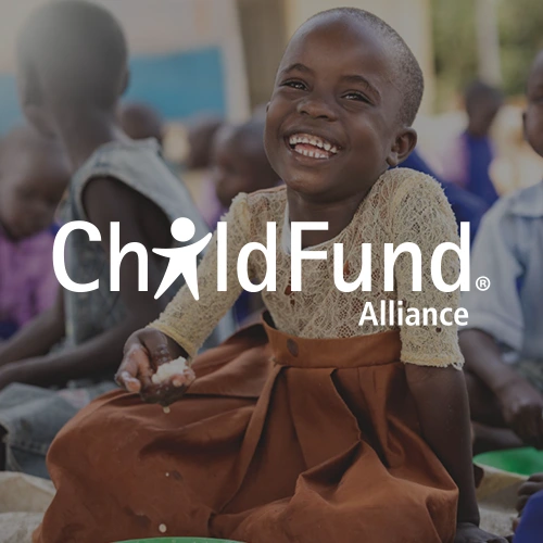 Child fund logo on top of an image of a young girl sitting on the floor