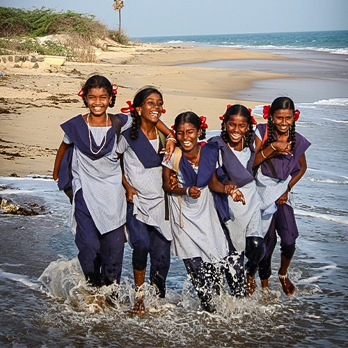 a group of sponsored girls at the beach launching